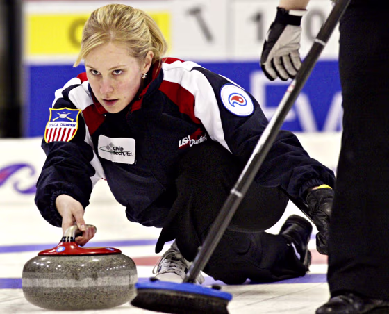 Team USA skip Cassie Johnson is pictured delivering&nbsp;a stone against Team Canada at the World Womens Curling Championship in Paisley, Scotland in this file photo. When Johnson competes with the U.S. curling team at the upcoming 2006 Winter Olympics in Italy, she'll have an expanded entourage cheering her on, all making the trip to Turin courtesy of Bank of America. 